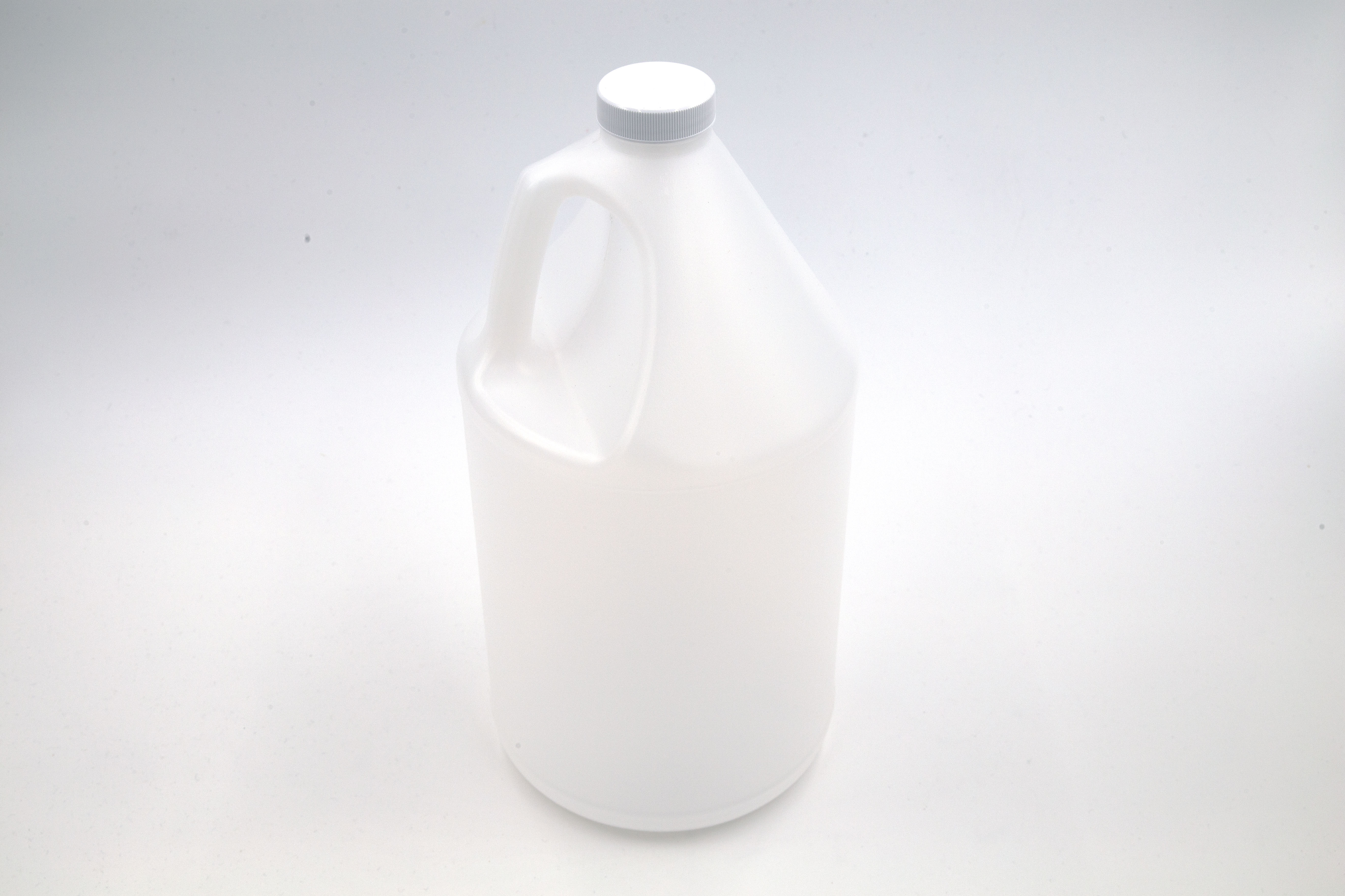 Opaque plastic jug on white background